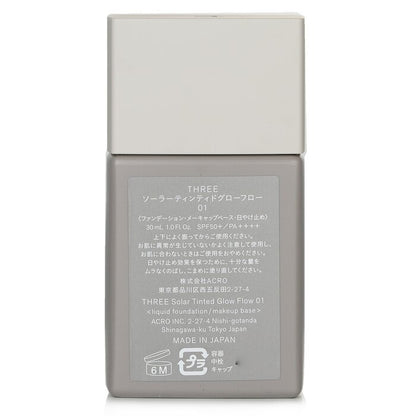 THREE Solar getönte Glow Flow Flüssiggrundierung LSF 50 – Nr. 01, 30 ml