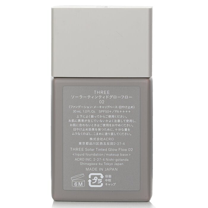 THREE Solar getönte Glow Flow Flüssiggrundierung LSF 50 – Nr. 02, 30 ml