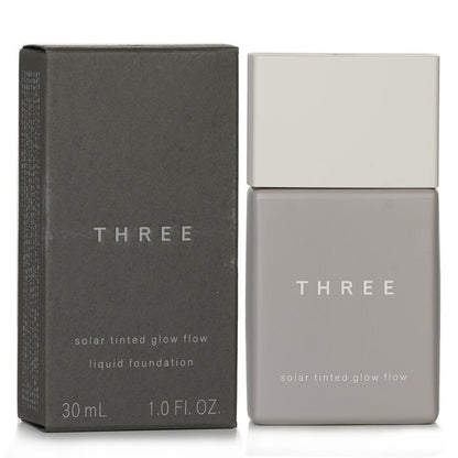 THREE Solar getönte Glow Flow Flüssiggrundierung LSF 50 - Nr. 04 30 ml