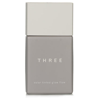 THREE Solar getönte Glow Flow Flüssiggrundierung LSF 50 - Nr. 04 30 ml